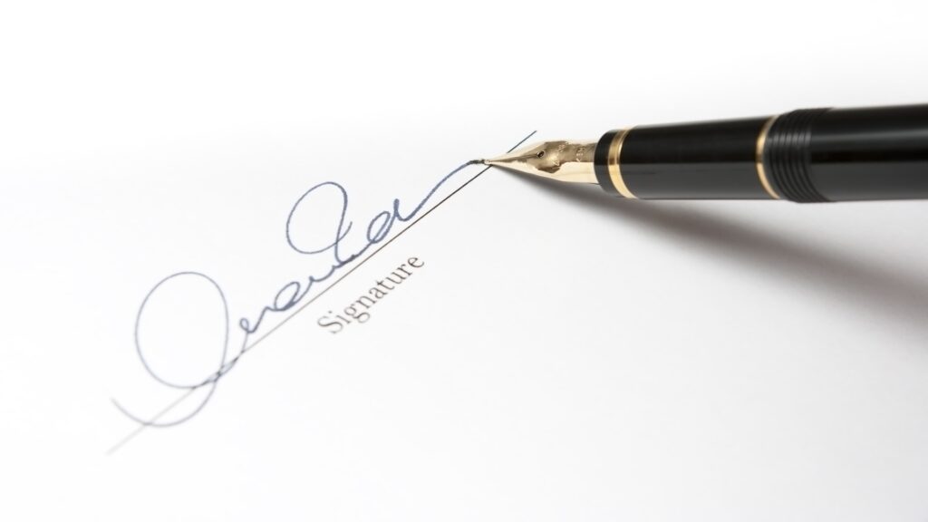 signature with gold fountain pen