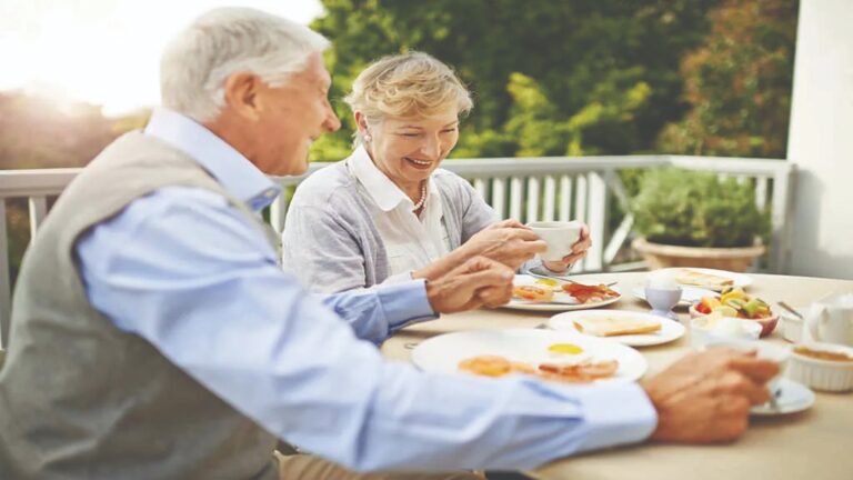 couple enjoying breakfast outside